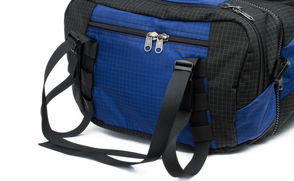 The lash straps at the top of the main pocket of the Hero's Journey in Nordic (blue with grey grid) 400 Halcyon.